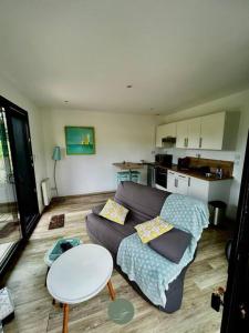 a living room with a couch and a table at Casa Tagomago in Andernos-les-Bains +26 photos