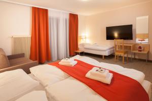 Ένα ή περισσότερα κρεβάτια σε δωμάτιο στο Residence AlpenHeart