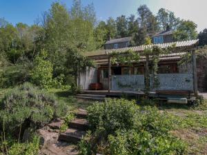 an old house with a pergola in a garden at Ferryman's Lodge in Chepstow +32 photos
