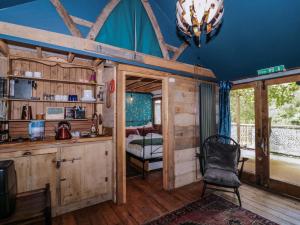 a room with a desk and a chair in a cabin at Ferryman's Lodge in Chepstow