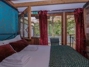 a bedroom with a large bed in a house at Ferryman's Lodge in Chepstow