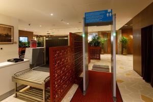 a lobby with a bench in a building at 080 Transit Hotel, T2 in Bangalore