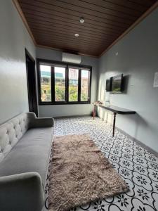 a large living room with a couch and a television at Bông Phố Cổ Homestay in Ninh Binh