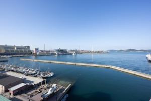 a group of boats docked at a dock in the water at ホテルリノ in Kitakyushu