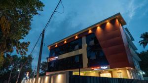 a building with lights on the side of it at Sreebhadra Residency in Chavara