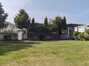 a house with a yard at Amrit hotel & resort in Nārāyanpur
