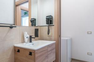 a bathroom with a sink and a mirror at Baglio Netino in Noto +32 photos