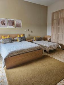 two beds sitting in a room with at Sole raggiante Lia Darzillo in Afragola