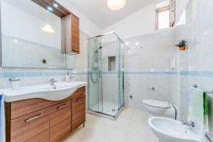 a bathroom with a sink and a shower and a toilet at Casa in Via Seminario Otranto in Otranto
