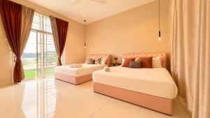 a bedroom with two beds and a large window at Casa Le Seabreeze 4BR with Projector in Kuah