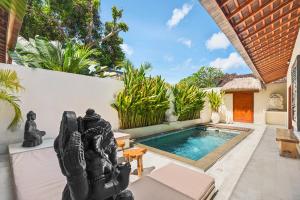a pool in the backyard of a villa at Tropical Villas Complex in Jimbaran +5 photos