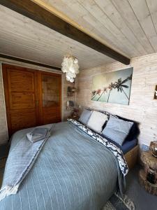 a bedroom with a large bed in a room at The Marina Treehouse in Hamuliakovo