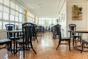 a row of tables and chairs in a restaurant at Hotel Costa Blanca Rojales in Rojales