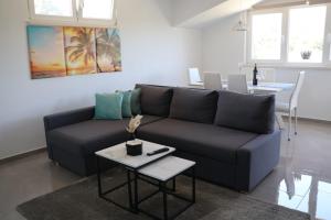a living room with a couch and a table at Seba Apartments in Korčula