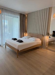 a bedroom with a large bed in a room at Baltic Infinity Beach Spa in Międzyzdroje +24 photos