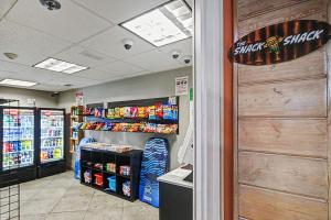 a store aisle with a shelf of chips and drinks at Carolinian Beach Resort in Myrtle Beach