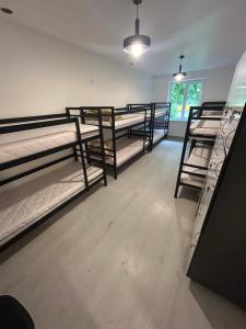 a group of bunk beds in a room at Хостел Мануфактура in Kharkiv