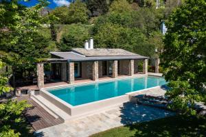an overhead view of a swimming pool in front of a house at Valeni Boutique Hotel & Spa in Portaria