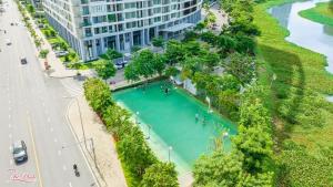 a large pool of water next to a building at Premium Midtown serviced apartment in Ho Chi Minh City
