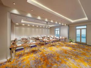a large room with tables and chairs in it at Mamaison Hotel Riverside Prague in Prague