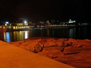 a river at night with rocks in the water at Hotel San Terenzo in Lerici