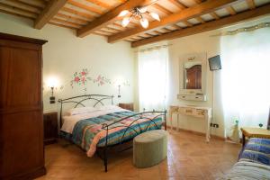 A bed or beds in a room at B&B Antica Fonte del Latte