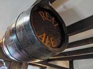 a metal sign that reads real food cafe at The Linden Tree in Gloucestershire