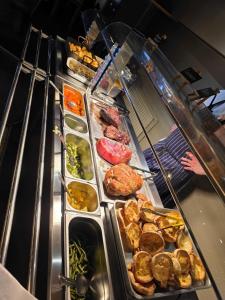 a buffet line with many different types of food at The Linden Tree in Gloucestershire