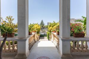 a hallway of a building with potted plants at Villa Ciccarese in Cursi