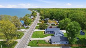 an aerial view of a house next to a road at Lake Rd E- Geneva in Geneva