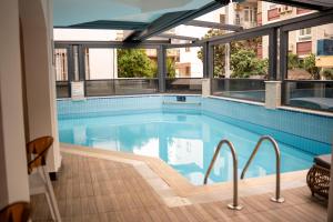 a swimming pool with a view of a building at Cleopatra Golden Beach Hotel in Alanya