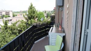 a balcony with a desk and a chair on a balcony at Sky Balcony - Milano Sud- vicino Humanitas e forum Assago in Rozzano
