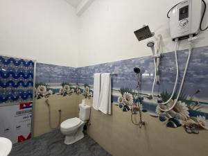 a bathroom with a shower and a toilet at Yala Dream Guest House in Tissamaharama +26 photos