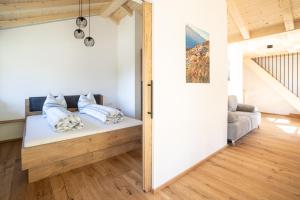 a room with a bed with pillows on it at Lechnerhof in Plaus +44 photos