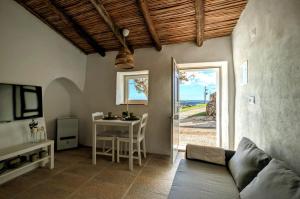 a living room with a couch and a table at Casa Nossa in Azinhal