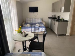 a small room with a small table and a bed at Ressa Apart in Marmaris