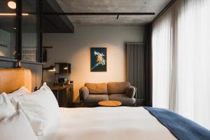 a hotel room with a bed and a couch at Exeter Hotel in Reykjavík +118 photos