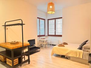 a bedroom with a bed and a desk and a table at Milano 2, cozy, Wi-Fi, minimum 2 nights in Segrate