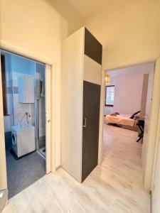 a room with a closet and a bedroom at Milano 2, cozy, Wi-Fi, minimum 2 nights in Segrate