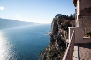a balcony of a building looking out over the ocean at Locanda Al Castelletto in Tremosine Sul Garda