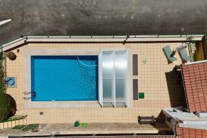 a swimming pool in the middle of a building at Moinhos Da Guimaroa in Cadafais +21 photos