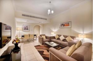 a living room with a couch and a table at Hotel Vasudha Inn-Near International Airport Delhi in New Delhi