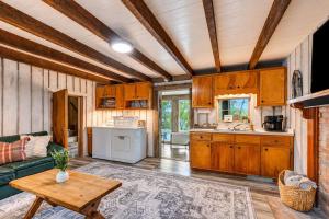 a kitchen with a couch and a table in a room at Hickory Haven Cozy Lakefront Escape & Dock in Cadiz