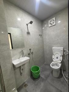 a bathroom with a sink and a toilet and a mirror at Hotel metro inn in Bhopal