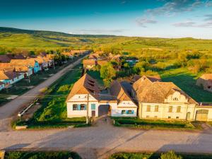 an aerial view of a house in a residential neighborhood at Azuria Viscri in Viscri
