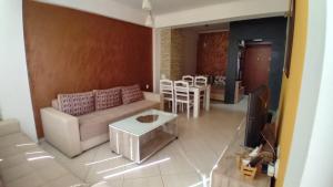 a living room with a couch and a table at Apartment Nika in Ohrid
