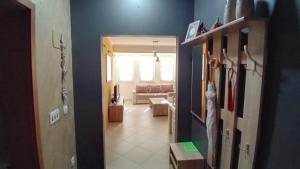 a hallway leading to a living room with blue walls at Apartment Nika in Ohrid