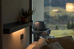 a living room with a couch and a window at Vershky Villas Верховина in Verkhovyna +76 photos
