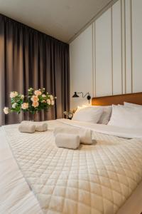 a bedroom with two beds with towels on them at ApartHotel S8 - Apartamenty Wrocław in Wrocław +20 photos
