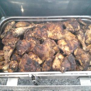 a pan of chicken being cooked in an oven at Grand Halomy Megan in Sharm El Sheikh